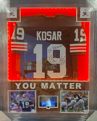 Cleveland Browns Bernie Kosar Hand Signed Autographed Custom Brown Jersey with GO BROWNS Inscription Framed with Suede Matting, Cutout Lettering, LED Lighting, & Video Highlights Includes COA